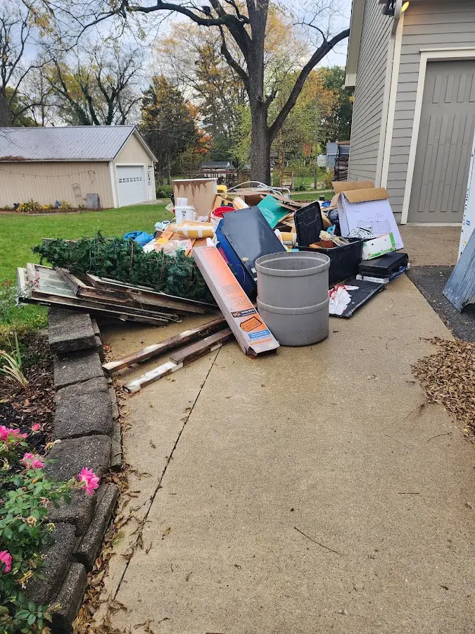 Dumpster being loaded with debris for 30 Yard Dumpster Rental in Springfield